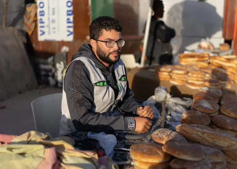 A bread seller with fresh loaves