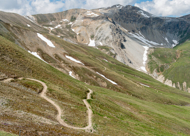 An alpine trail in the Engadin region of Switzerland on Marmot's Land bike route