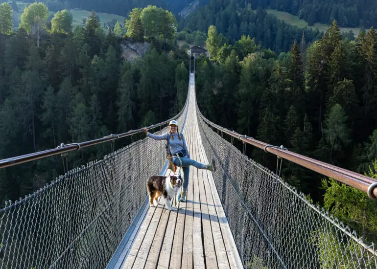 Leah and Oz on a suspension bridge on a hike in the lower Engadin region of Switzerland